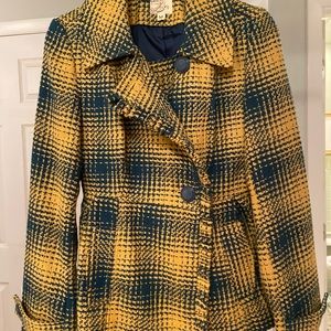 Wool blend jacket with front pockets.